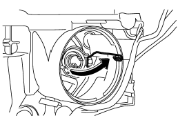 4. Remove the retainer spring.