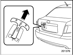 To open the trunk lid from inside the trunk, pull the yellow handle upward as indicated by the arrow on the handle.