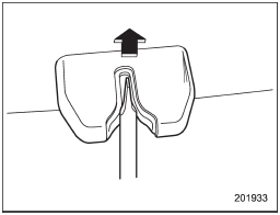 2. Use a flat-head screwdriver with a thin blade. Slide the screwdriver blade from the slit aperture of the lock assembly to the end until you hear a click.