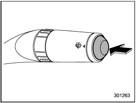 To wash the windshield, push the washer button at the end of the wiper control lever.