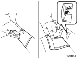 Peel off the anchorage cover from the selected side of the rear seatback to expose