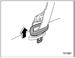 The rear center seatbelt is stowed in the seatbelt holder on the right side of the cargo area.