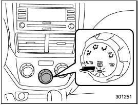 To activate the defogger and deicer system, push the control switch that is located on the climate control panel. The rear window defogger, outside mirror defogger and windshield wiper deicer are activated simultaneously. The indicator light on the control switch illuminates while the defogger and deicer system is activated.