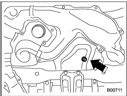 4. Drain out the engine oil by removing the drain plug while the engine is still warm. The used oil should be drained into an appropriate container and disposed of properly.