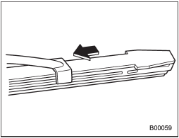 3. Align the claws of the metal support with the grooves in the rubber and slide the blade rubber assembly into the metal support until it locks.