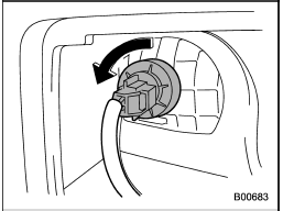 2. Turn the bulb socket counterclockwise and remove it.