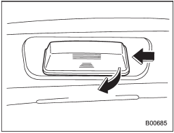 1. Insert a finger into the right side of the license plate light cover, then press once to the left and pull out to remove the cover.