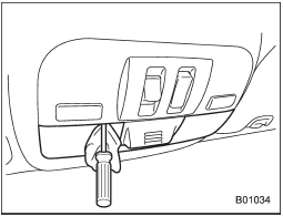 1. Remove the lens by prying the edge of the lens with a flat-head screwdriver.