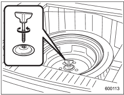 6. Take out the tool bucket and turn the attaching bolt counterclockwise, then take the spare tire out.