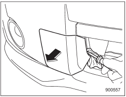 2. Cover the tip of a flat-head screwdriver with vinyl tape or cloth so that it will not scratch the bumper. Insert the flat-head screwdriver into the cutout of the cover and pry open the cover.