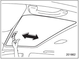 The sun shade can be slid forward or backward by hand while the moonroof is closed.