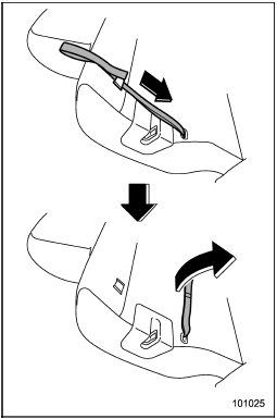 1. Pull the lock release strap behind the seatback out from its holder.